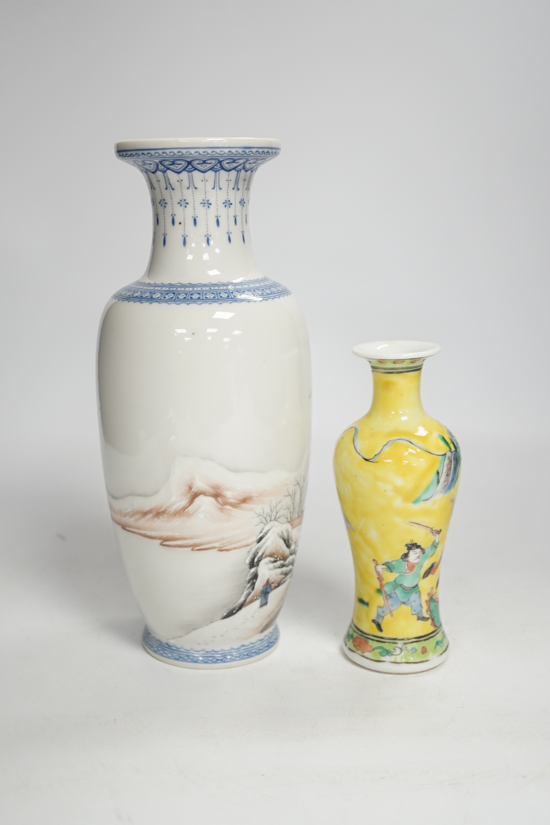 A Chinese Republic period enamelled porcelain ‘winter scene’ vase, and a yellow ground ‘warriors’ vase, largest 24cm high